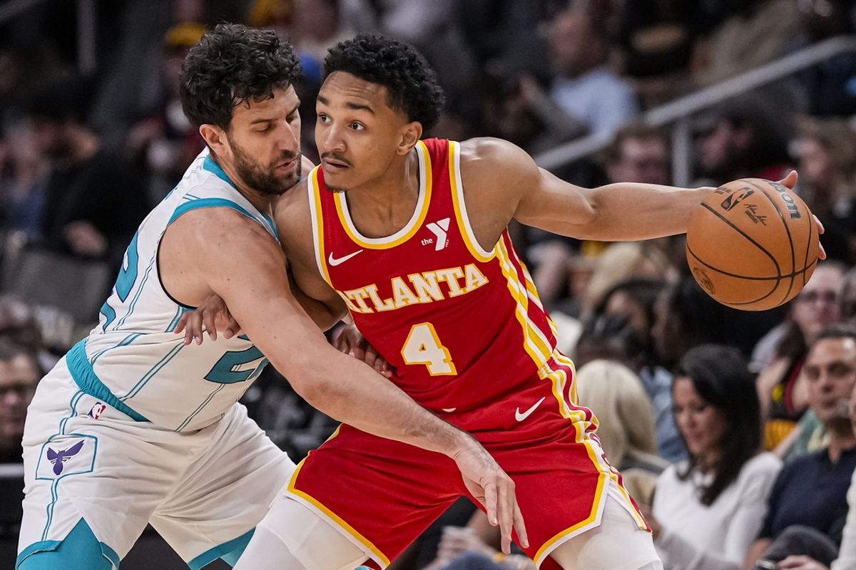 Apr 10, 2024; Atlanta, Georgia, USA; Atlanta Hawks guard Kobe Bufkin (4) is defended by Charlotte Hornets guard Vasilije Micic (22) during the second half at State Farm Arena. Mandatory Credit: Dale Zanine-USA TODAY Sports