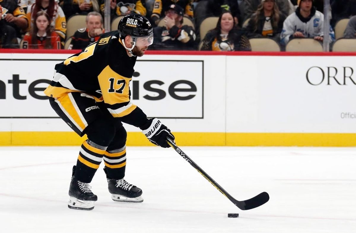 Oct 30, 2023; Pittsburgh, Pennsylvania, USA;  Pittsburgh Penguins right wing Bryan Rust (17) skates with the puck against the Anaheim Ducks during the first period at PPG Paints Arena.