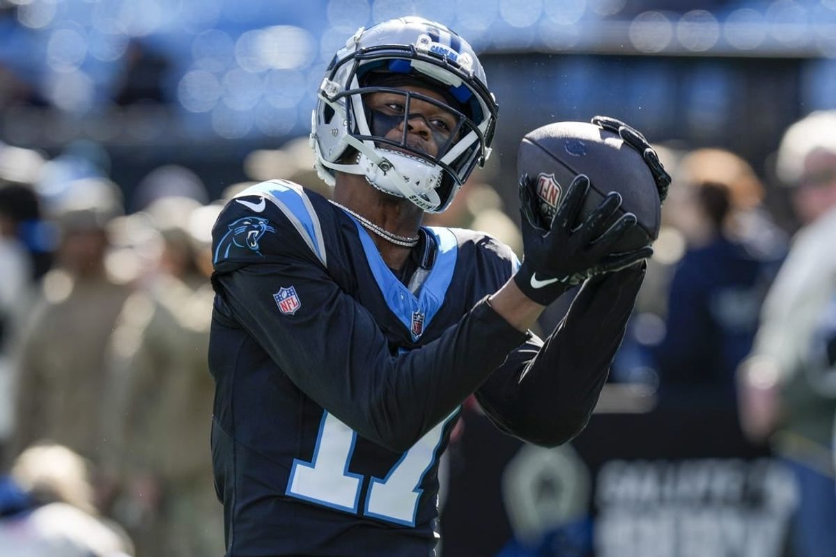 Jan 7, 2024; Charlotte, North Carolina, USA; Carolina Panthers wide receiver DJ Chark Jr. (17) makes a catch  during pregame warm ups against the Tampa Bay Buccaneers at Bank of America Stadium.