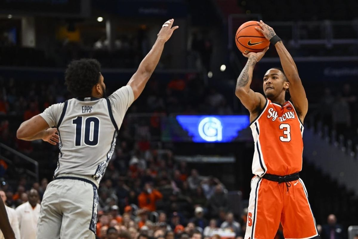 Dec 9, 2023; Washington, District of Columbia, USA; Syracuse Orange guard Judah Mintz (3) shoots over Georgetown Hoyas guard Jayden Epps (10) during the first half at Capital One Arena.
