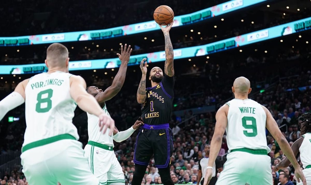 Feb 1, 2024; Boston, Massachusetts, USA; Los Angeles Lakers guard D'Angelo Russell (1) shoots against the Boston Celtics in the first quarter at TD Garden.