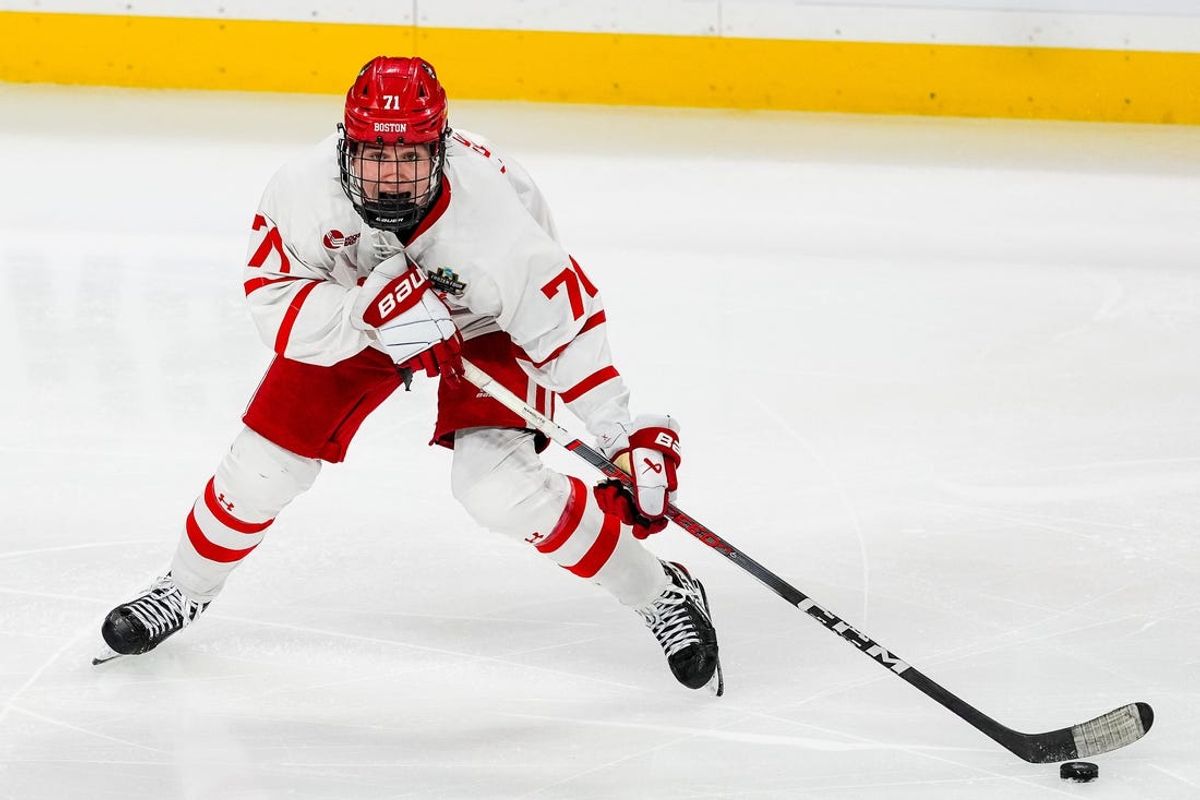 Apr 11, 2024; Saint Paul, Minnesota, USA; Boston U. forward Macklin Celebrini (71) carries the puck in the semifinals of the 2024 Frozen Four college ice hockey tournament during the third period against Denver at Xcel Energy Center. Mandatory Credit: Brace Hemmelgarn-USA TODAY Sports