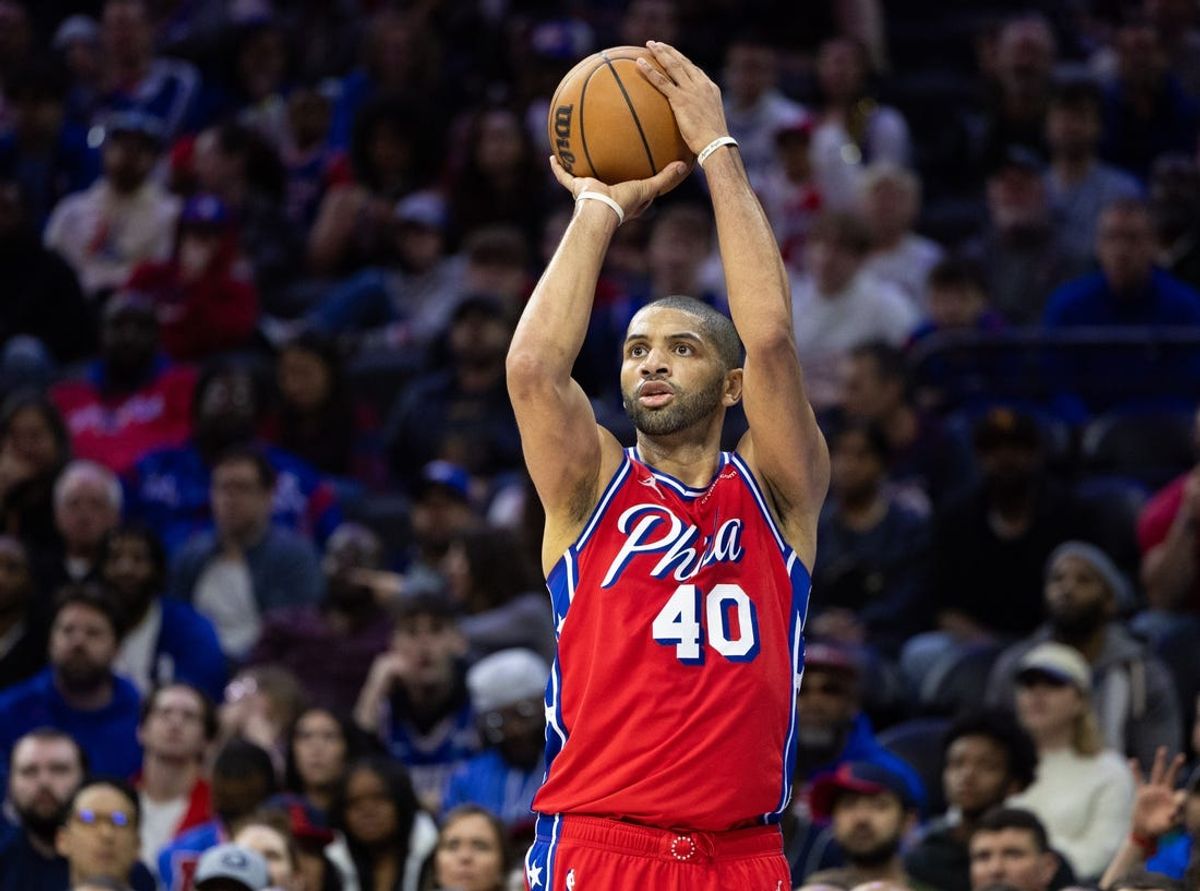 Apr 12, 2024; Philadelphia, Pennsylvania, USA; Philadelphia 76ers forward Nicolas Batum (40) shoots the ball against the Orlando Magic during the fourth quarter at Wells Fargo Center. Mandatory Credit: Bill Streicher-USA TODAY Sports