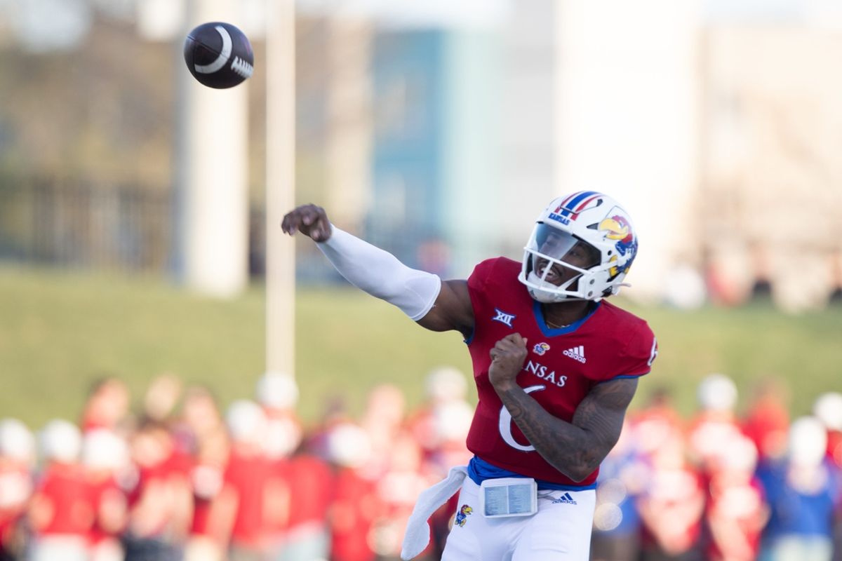 Kansas redshirt junior quarterback Jalon Daniels (6) fires off a pass during Friday's Spring Preview at Rock Chalk Park.