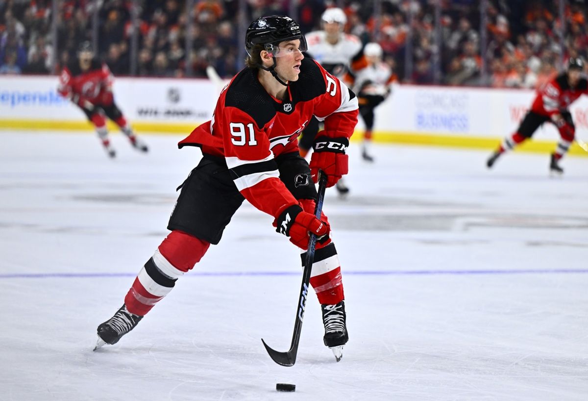 Apr 13, 2024; Philadelphia, Pennsylvania, USA; New Jersey Devils center Dawson Mercer (91) controls the puck against the Philadelphia Flyers in the second period at Wells Fargo Center. Mandatory Credit: Kyle Ross-Imagn Images