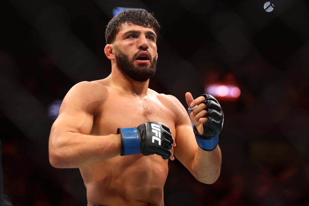 Apr 13, 2024; Las Vegas, Nevada, USA; Arman Tsarukyan (blue gloves) reacts after defeating Charles Oliveira (not pictured)  during UFC 300 at T-Mobile Arena. Mandatory Credit: Mark J. Rebilas-Imagn Images