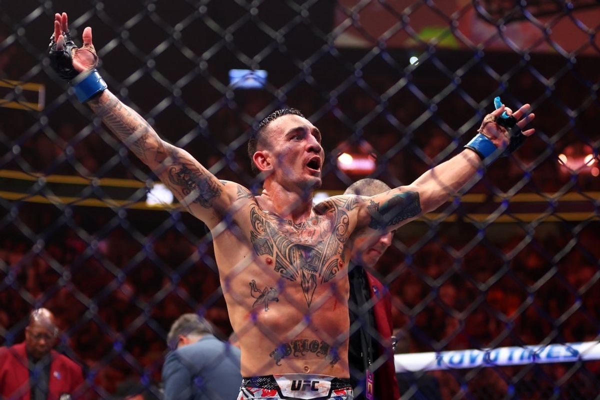 Apr 13, 2024; Las Vegas, Nevada, USA; Max Holloway (blue gloves) reacts after defeating Justin Gaethje (not pictured) during UFC 300 at T-Mobile Arena. Mandatory Credit: Mark J. Rebilas-Imagn Images