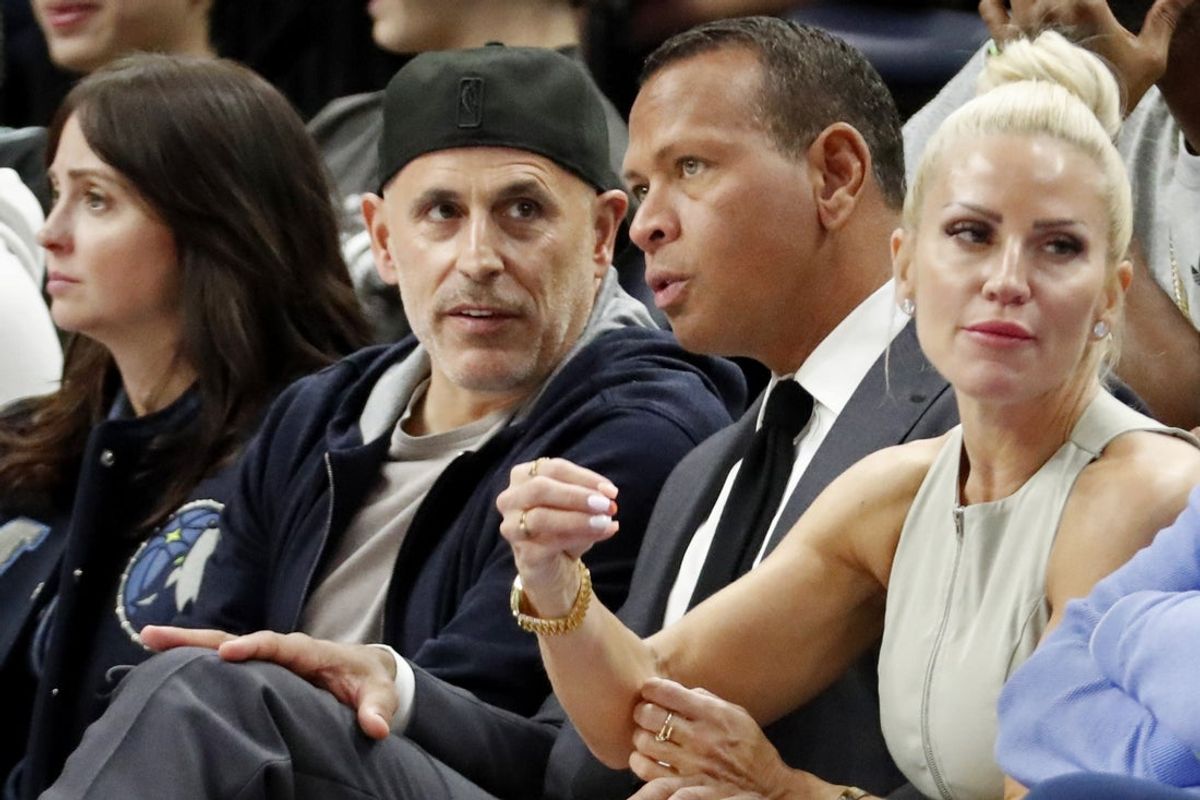 Apr 14, 2024; Minneapolis, Minnesota, USA; Minnesota Timberwolves and Lynx minority owners Marc Lore and Alex Rodriguez talk in the fourth quarter of the game against the Phoenix Suns at Target Center. Mandatory Credit: Bruce Kluckhohn-Imagn Images