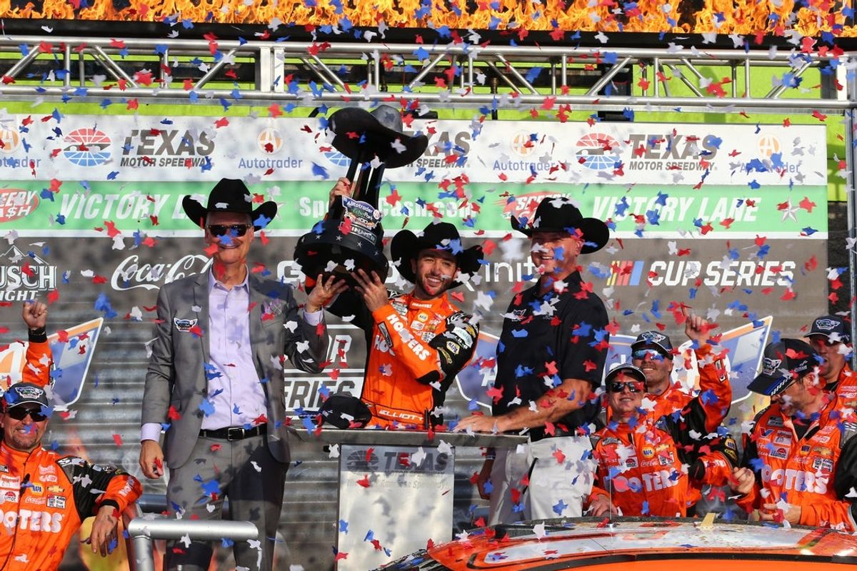 Apr 14, 2024; Fort Worth, Texas, USA;  NASCAR Cup Series driver Chase Elliott (9) celebrates in Victory Lane after winning the NASCAR Cup Series AutoTrader EchoPark 400 at Texas Motor Speedway. Mandatory Credit: Michael C. Johnson-Imagn Images