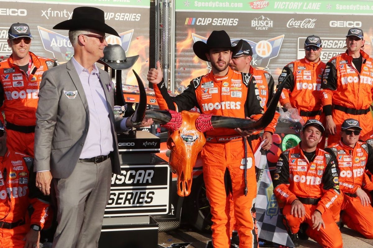 Apr 14, 2024; Fort Worth, Texas, USA; NASCAR Cup Series driver Chase Elliott (9) and Texas Motor Speedway Executive Vice President and General Manager Mark Faber in Victory Lane after the NASCAR Cup Series AutoTrader EchoPark 400 at Texas Motor Speedway. Mandatory Credit: Michael C. Johnson-Imagn Images