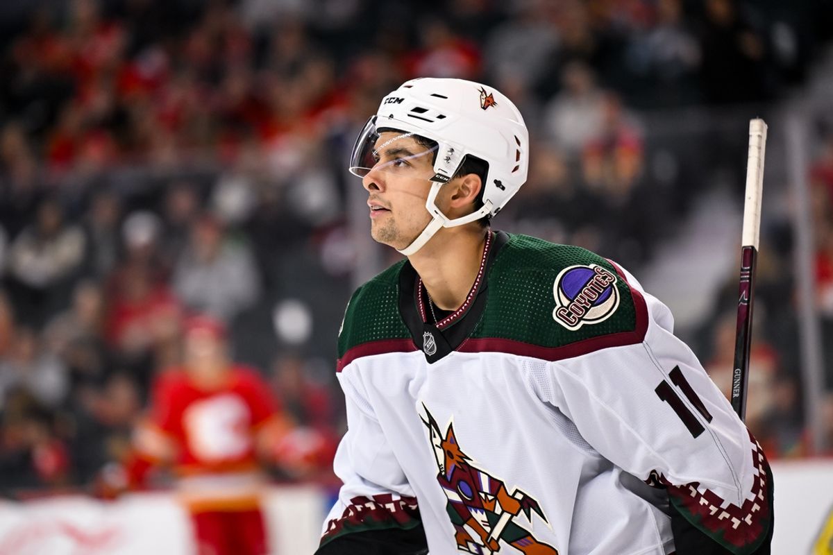 Apr 14, 2024; Calgary, Alberta, CAN; Arizona Coyotes right wing Dylan Guenther (11) celebrates after scoring a goal against the Calgary Flames during the second period at Scotiabank Saddledome. Mandatory Credit: Brett Holmes-Imagn Images