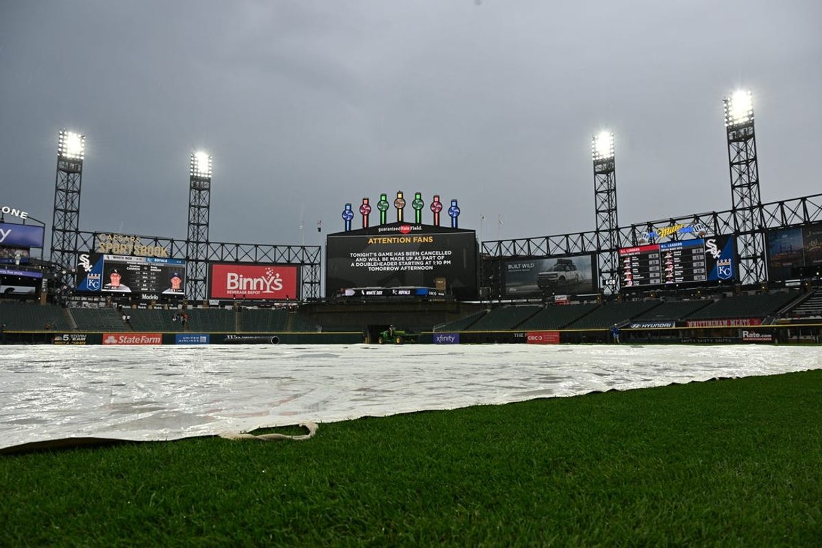 Apr 16, 2024; Chicago, Illinois, USA;  A view of the tarp on the field and the scoreboard after a game between the Kansas City Royals and the Chicago White Sox is postponed due to weather at Guaranteed Rate Field. Mandatory Credit: Jamie Sabau-USA TODAY Sports