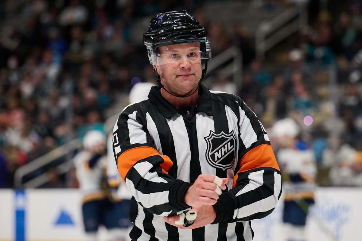Apr 6, 2024; San Jose, California, USA; Referee Kyle Rehman (10) during the game between the San Jose Sharks and the St. Louis Blues in the third period at SAP Center at San Jose. Mandatory Credit: Robert Edwards-USA TODAY Sports