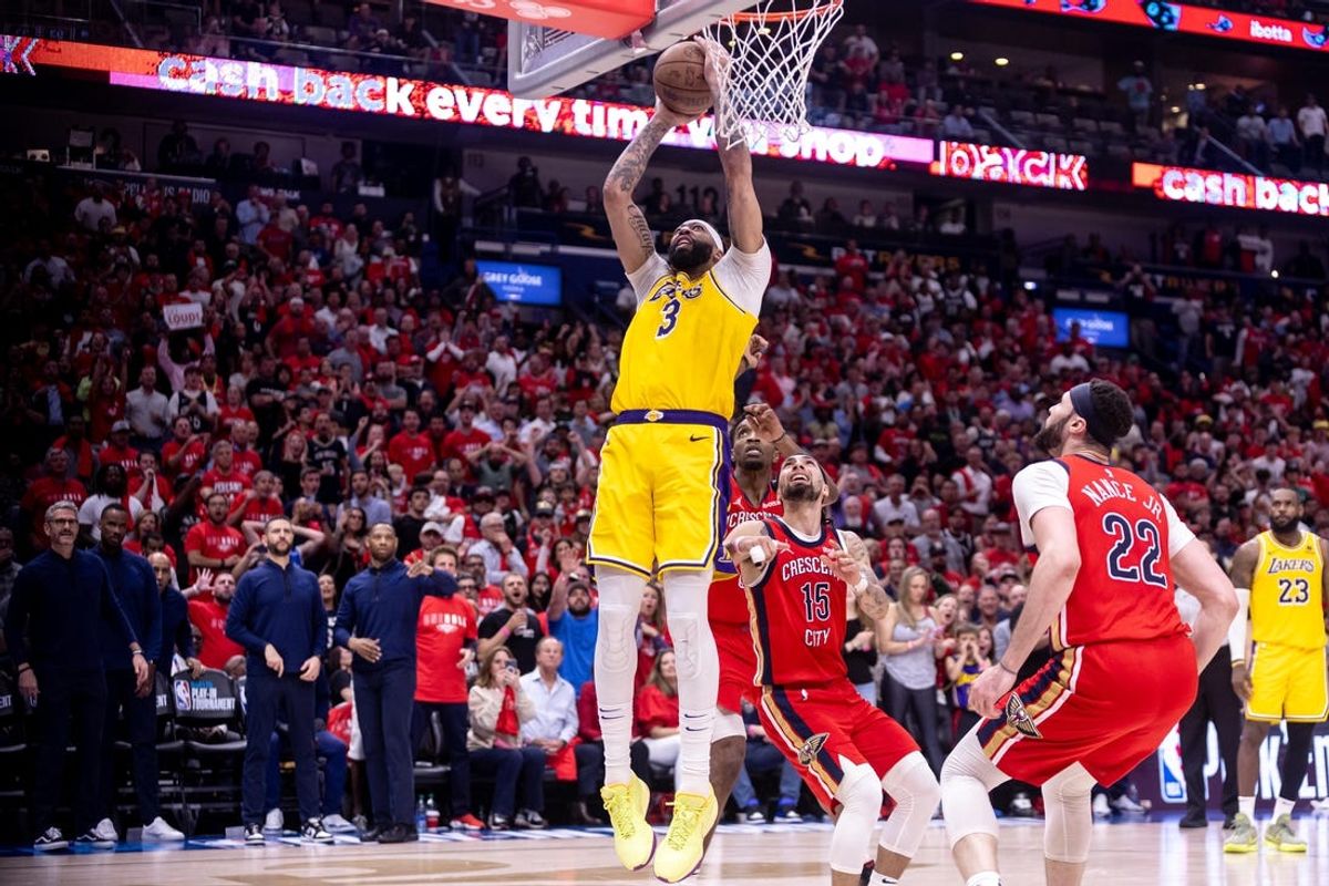 Apr 16, 2024; New Orleans, Louisiana, USA; Los Angeles Lakers forward Anthony Davis (3) shoots against New Orleans Pelicans guard Jose Alvarado (15) during the second half of a play-in game of the 2024 NBA playoffs at Smoothie King Center. Mandatory Credit: Stephen Lew-USA TODAY Sports