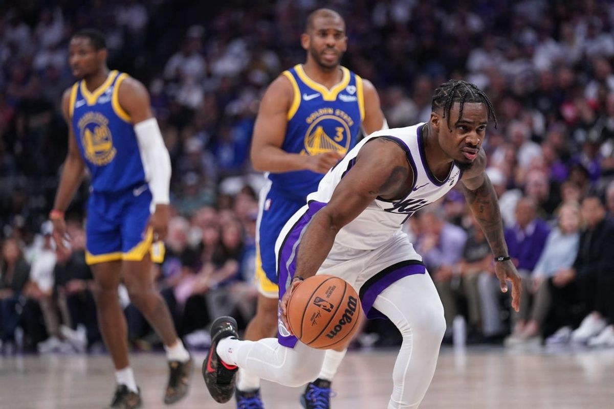 Apr 16, 2024; Sacramento, California, USA; Sacramento Kings guard Davion Mitchell (15) dribbles the ball against the Golden State Warriors in the first quarter during a play-in game of the 2024 NBA playoffs at the Golden 1 Center. Mandatory Credit: Cary Edmondson-USA TODAY Sports