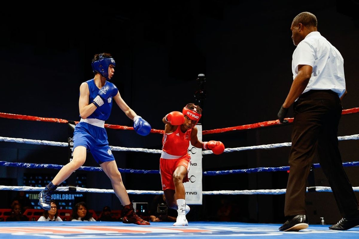 Apr 16, 2024; Pueblo, Colorado, USA; Jucielen Romeu (BRA) in red and Yu-Ting Lin (TPE) in blue compete in the elite female 57kg category at Pueblo Convention Center. Mandatory Credit: Isaiah J. Downing-Imagn Images