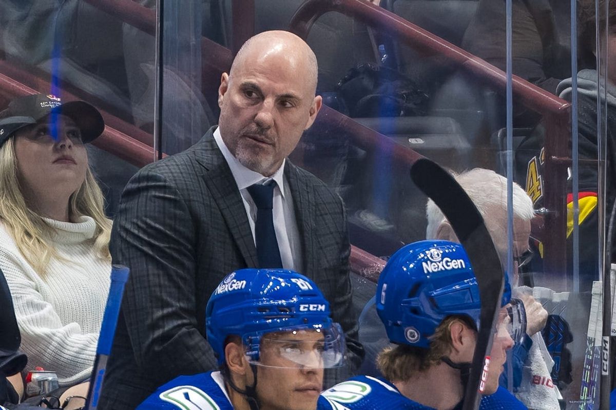 Apr 16, 2024; Vancouver, British Columbia, CAN; Vancouver Canucks head coach Rick Tocchet on the bench against the Calgary Flames in the first period at Rogers Arena. Mandatory Credit: Bob Frid-USA TODAY Sports