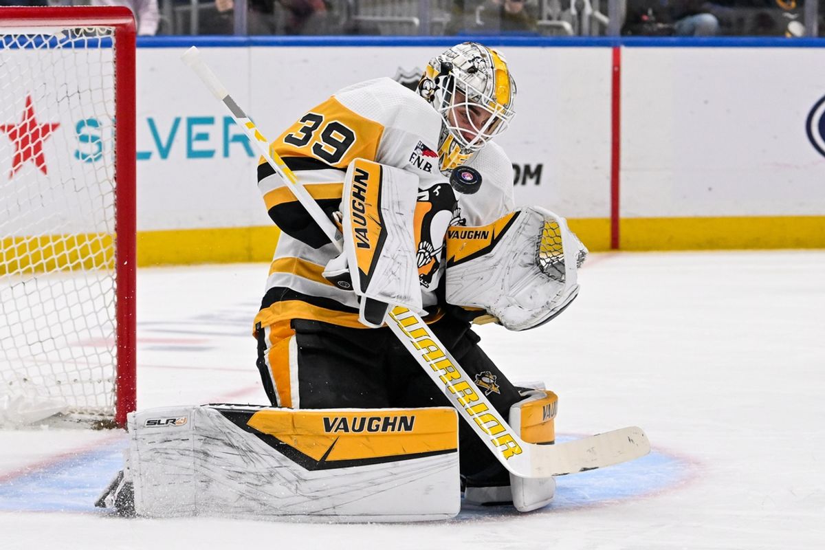 Apr 17, 2024; Elmont, New York, USA;  Pittsburgh Penguins goaltender Alex Nedeljkovic (39) makes a save against the New York Islanders during the second period at UBS Arena. Mandatory Credit: Dennis Schneidler-Imagn Images