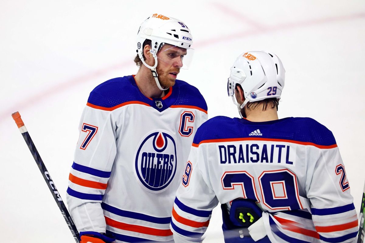 Apr 17, 2024; Tempe, Arizona, USA;  Edmonton Oilers center Connor McDavid (97) talks with center Leon Draisaitl (29) during the second period of the game against the Arizona Coyotes at Mullett Arena. Mandatory Credit: Mark J. Rebilas-Imagn Images