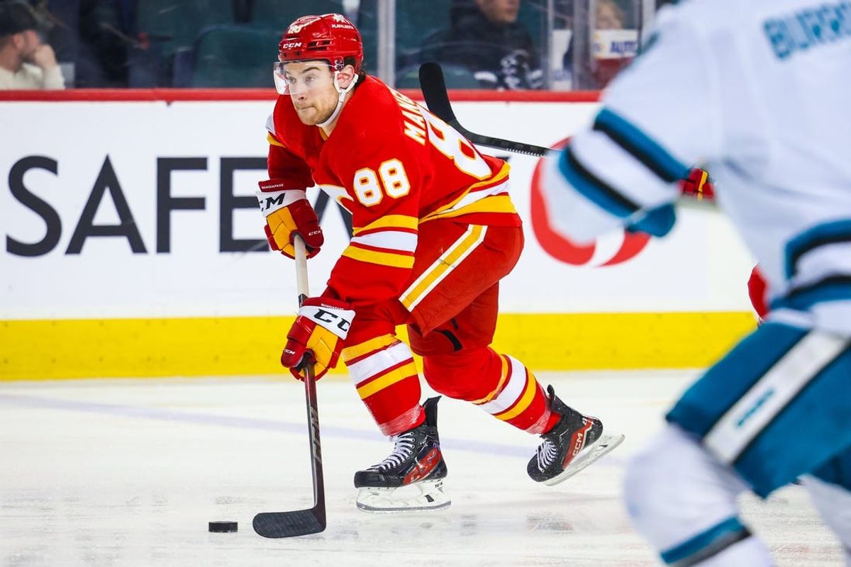 Apr 18, 2024; Calgary, Alberta, CAN; Calgary Flames left wing Andrew Mangiapane (88) skates with the puck against the San Jose Sharks during the second period at Scotiabank Saddledome. Mandatory Credit: Sergei Belski-USA TODAY Sports