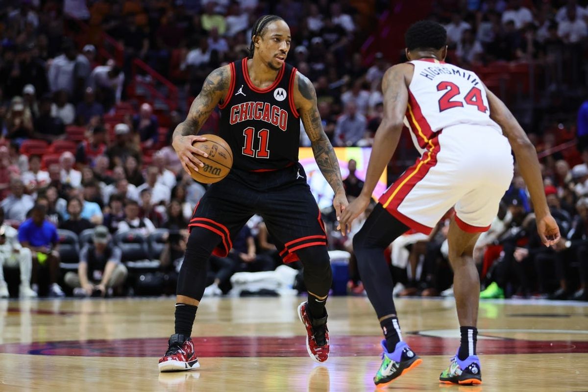 Apr 19, 2024; Miami, Florida, USA; Chicago Bulls forward DeMar DeRozan (11) dribbles the basketball as Miami Heat forward Haywood Highsmith (24) defends in the first quarter during a play-in game of the 2024 NBA playoffs at Kaseya Center. Mandatory Credit: Sam Navarro-USA TODAY Sports