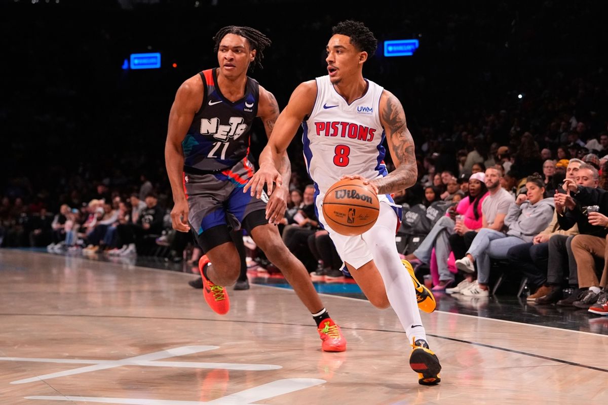 Apr 6, 2024; Brooklyn, New York, USA; Detroit Pistons guard Jared Rhoden (8) dribbles the ball past Brooklyn Nets forward Noah Clowney (21) during the first half at Barclays Center. Mandatory Credit: Gregory Fisher-USA TODAY Sports
