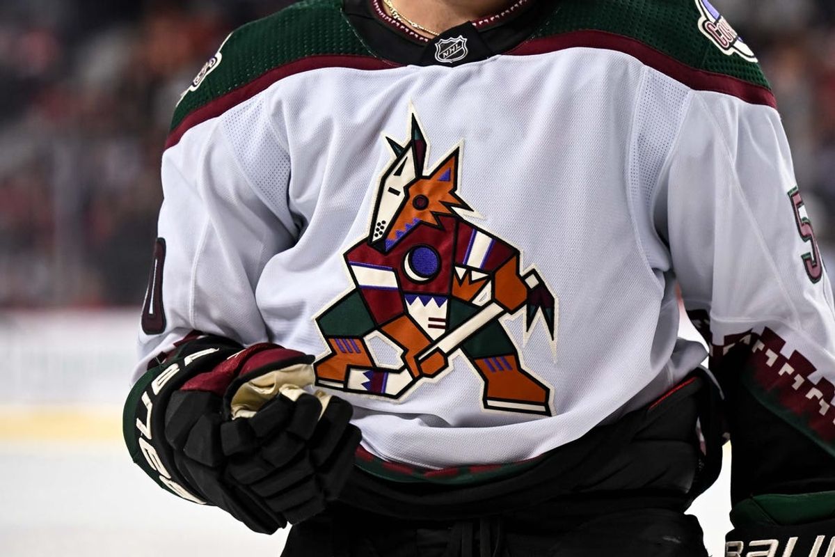 Apr 14, 2024; Calgary, Alberta, CAN; The Arizona Coyotes logo is shown during the third period of a game against the Calgary Flames at Scotiabank Saddledome. Mandatory Credit: Brett Holmes-USA TODAY Sports