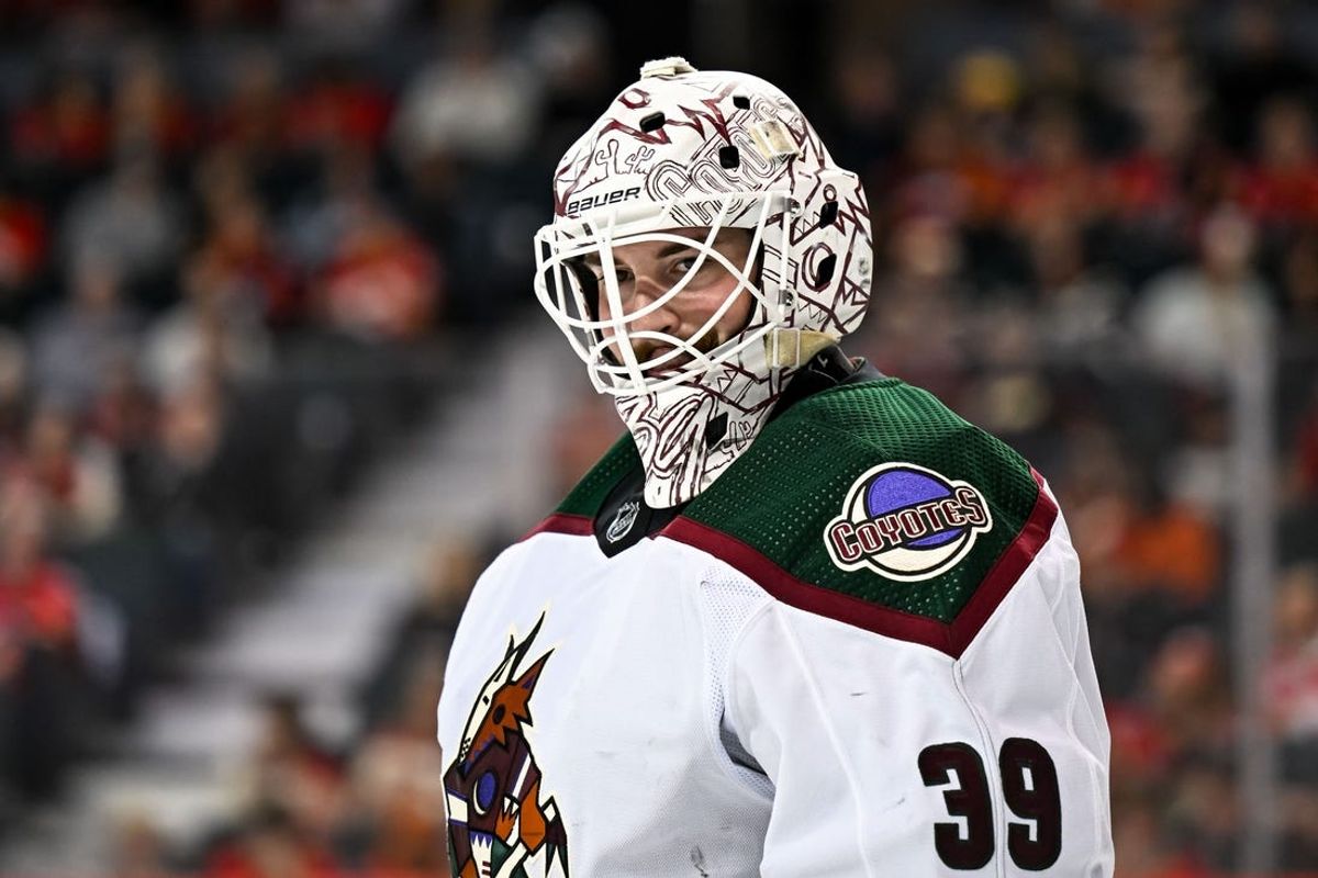 Apr 14, 2024; Calgary, Alberta, CAN; Arizona Coyotes goaltender Connor Ingram (39) looks on against the Calgary Flames during the third period at Scotiabank Saddledome. Mandatory Credit: Brett Holmes-USA TODAY Sports