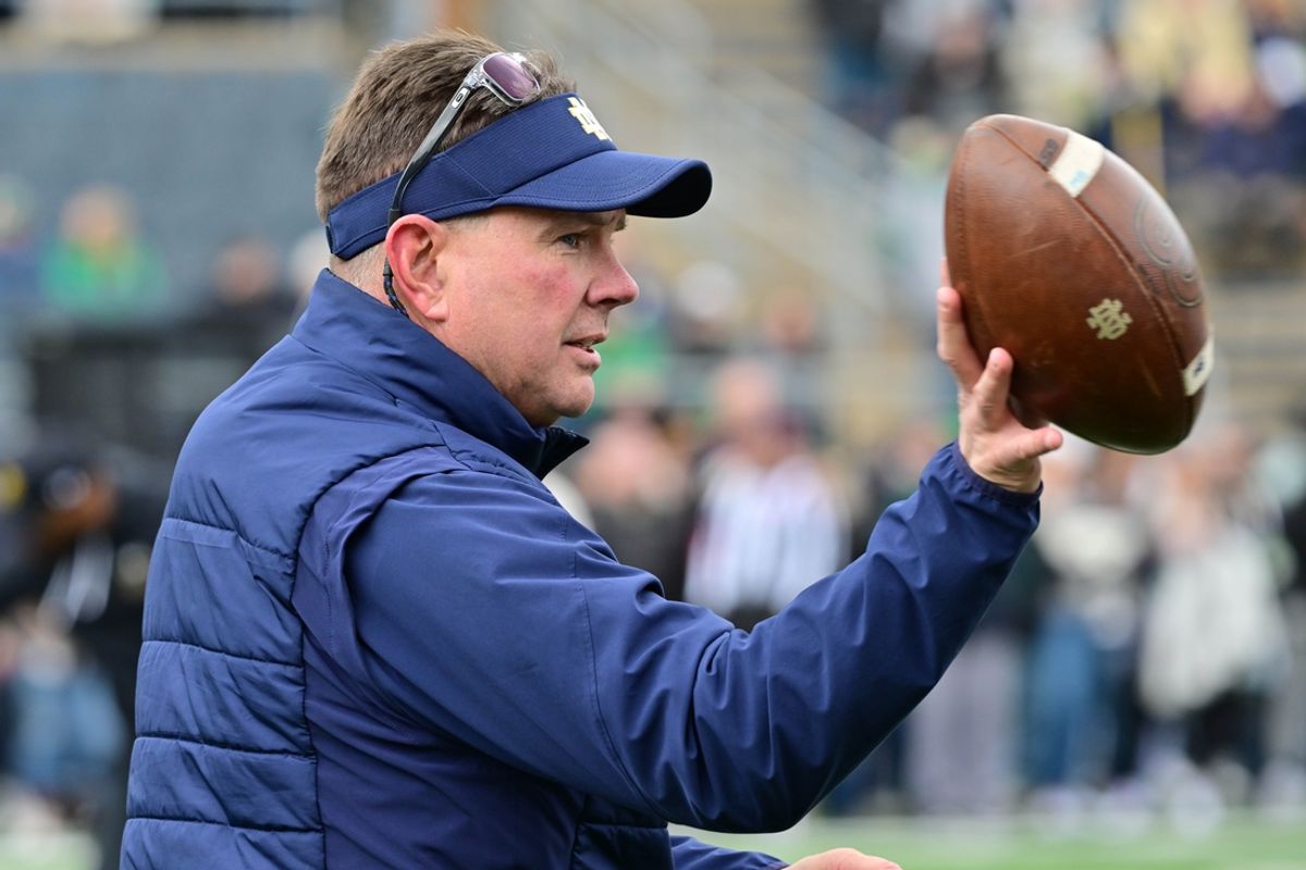 Apr 20, 2024; Notre Dame, IN, USA; Notre Dame Fighting Irish Defensive Coordinator Al Golden participates in warmups before the Blue-Gold Game at Notre Dame Stadium. Mandatory Credit: Matt Cashore-Imagn Images