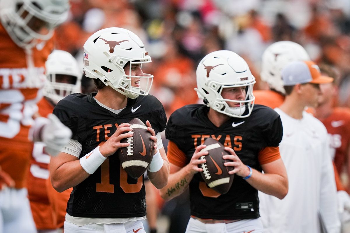 April 20, 2024; Austin, Texas, USA: Texas Longhorns quarterbacks Arch Manning (16), left, and  Quinn Ewers (3) throw passes while warming up ahead of the Longhorns' spring Orange and White game at Darrell K Royal Texas Memorial Stadium. Mandatory Credit: Sara Diggins-Imagn Images via American Statesman