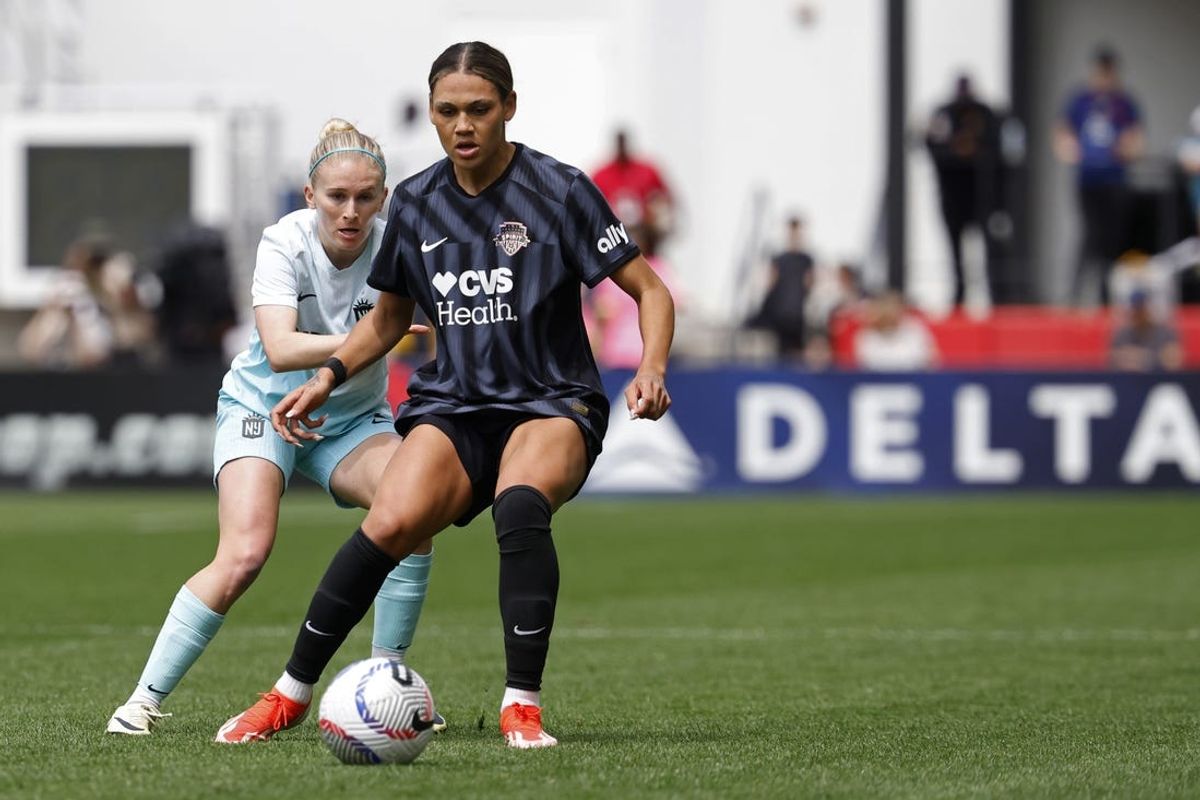 Apr 20, 2024; Washington, District of Columbia, USA; Washington Spirit forward Trinity Rodman (2) controls the ball as NJ/NY Gotham FC midfielder Jenna Nighswonger (2) defends at Audi Field. Mandatory Credit: Geoff Burke-USA TODAY Sports