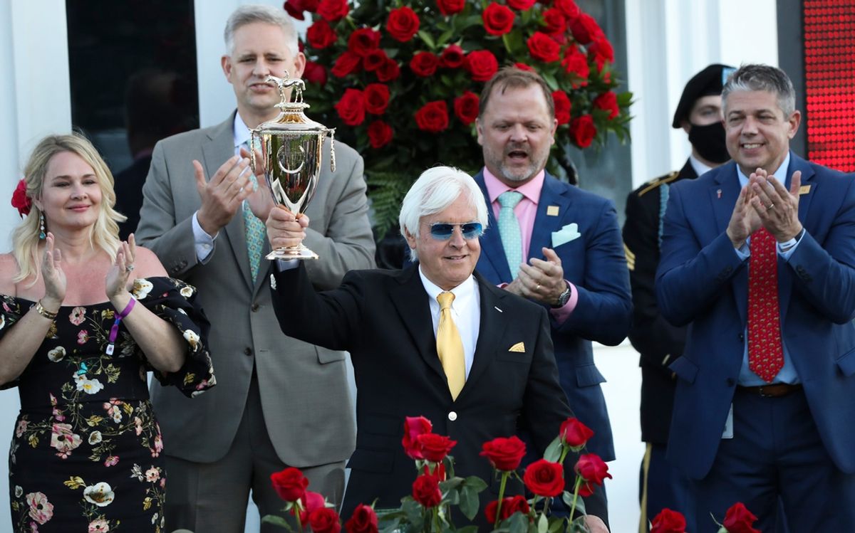 Medina Spirit trainer Bob Baffert celebrated in the winner's circle after winning the Kentucky Derby at Churchill Downs in Louisville, Ky. on May 1, 2021. Medina Spirit, trained by Bob Baffert, was disqualified as the winner of the Kentucky Derby 2021 and Mandaloun, trained by Brad Cox, was declared the winner.