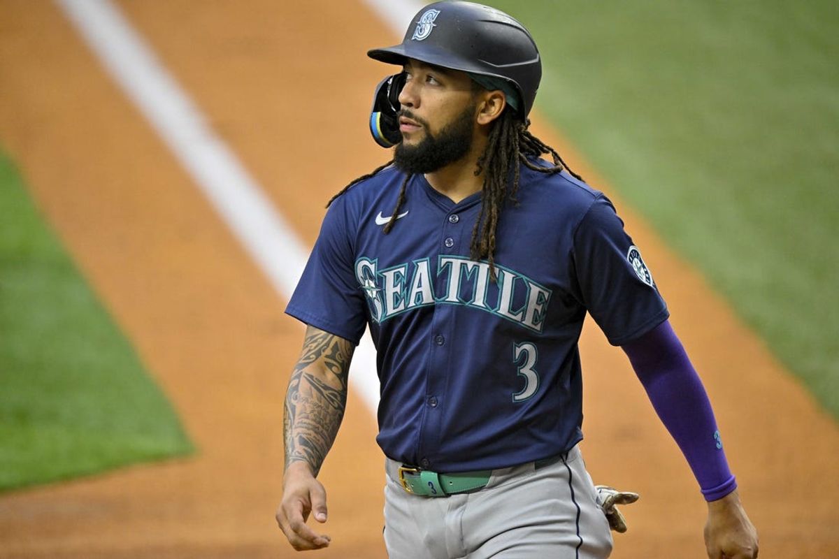 Apr 23, 2024; Arlington, Texas, USA; Seattle Mariners shortstop J.P. Crawford (3) scores against the Texas Rangers off a catcher Cal Raleigh (29) two run home run during the first inning at Globe Life Field. Mandatory Credit: Jerome Miron-USA TODAY Sports