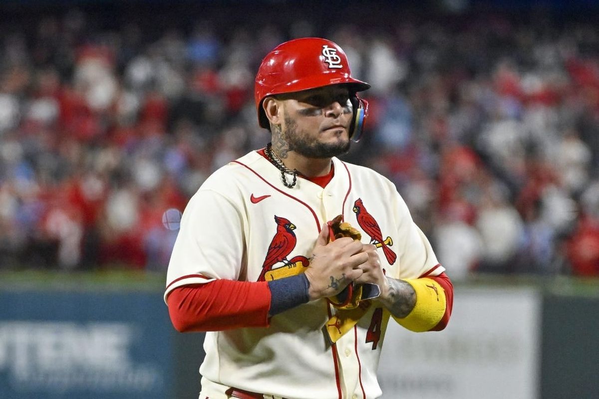Oct 8, 2022; St. Louis, Missouri, USA; St. Louis Cardinals catcher Yadier Molina (4) walks off the field after hitting a single for his final postseason at bat in the ninth inning against the Philadelphia Phillies during game two of the Wild Card series for the 2022 MLB Playoffs at Busch Stadium.