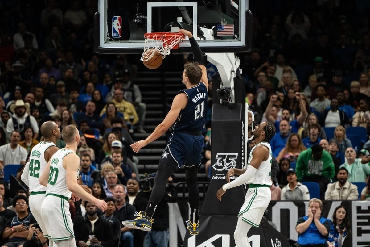 Nov 24, 2023; Orlando, Florida, USA; Orlando Magic forward Moritz Wagner (21) dunks the ball against the Boston Celtics in the second quarter at Amway Center.