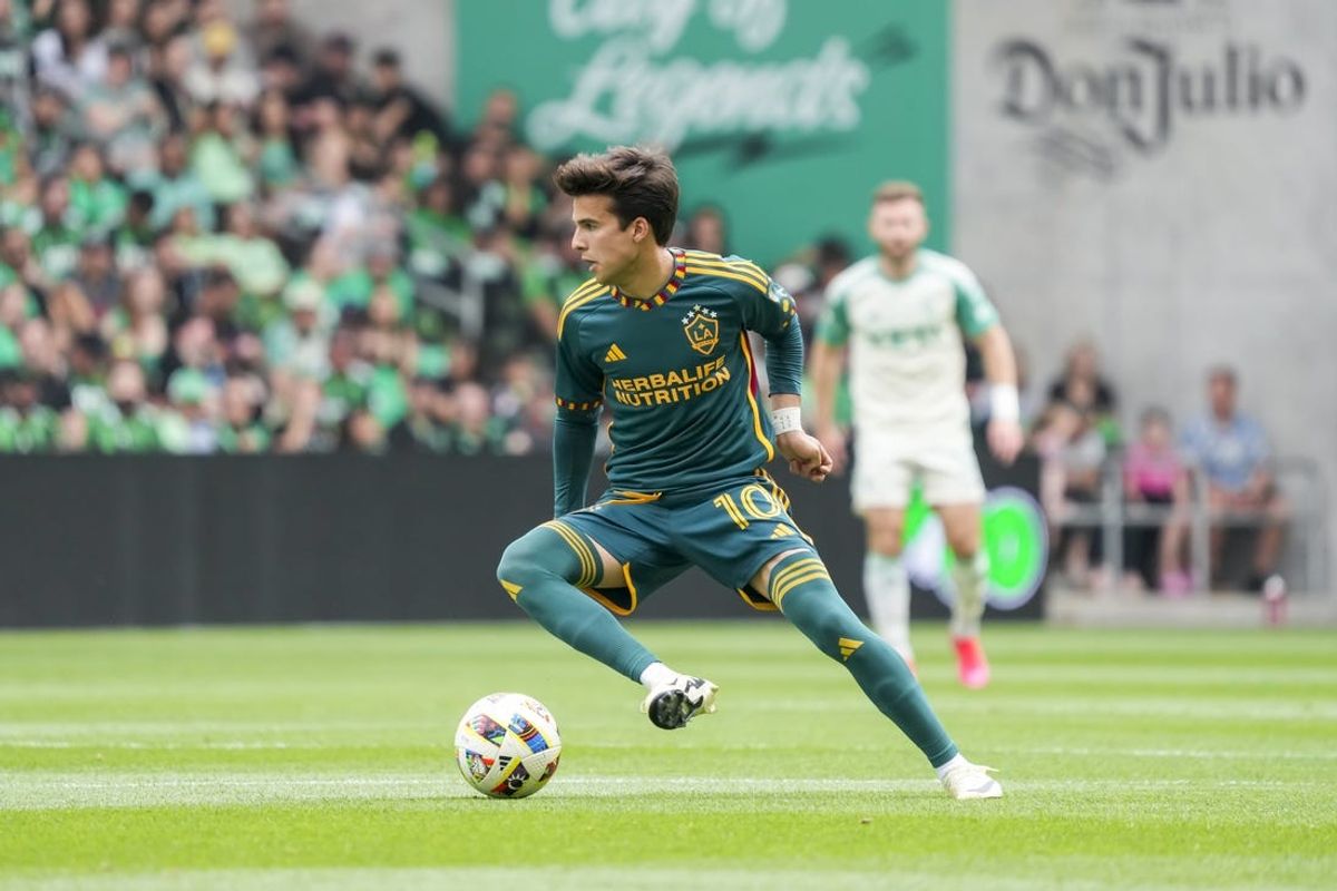 Apr 27, 2024; Austin, Texas, USA; LA Galaxy midfielder Riqui Puig (10) maneuvers with the ball against Austin FC at Q2 Stadium. Mandatory Credit: Scott Wachter-USA TODAY Sports