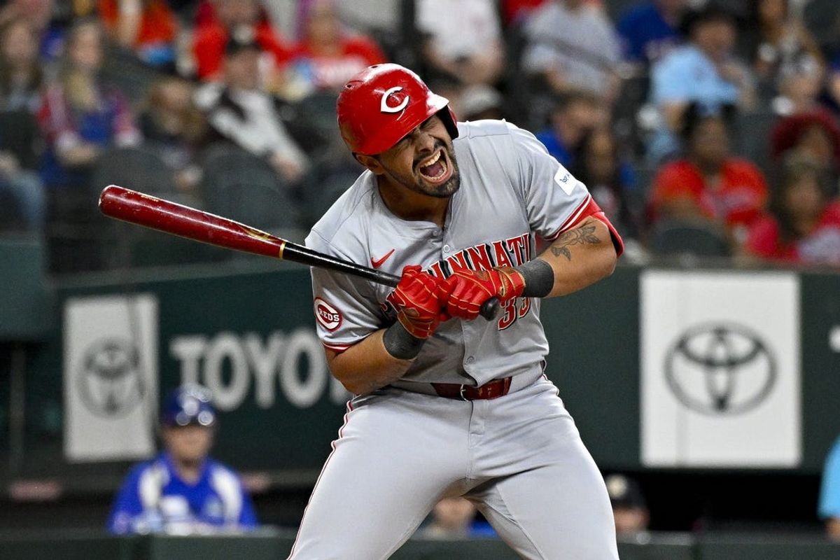 Apr 27, 2024; Arlington, Texas, USA; Cincinnati Reds first baseman Christian Encarnacion-Strand (33) reacts to being hit by a pitch during the second inning against the Texas Rangers at Globe Life Field. Mandatory Credit: Jerome Miron-USA TODAY Sports