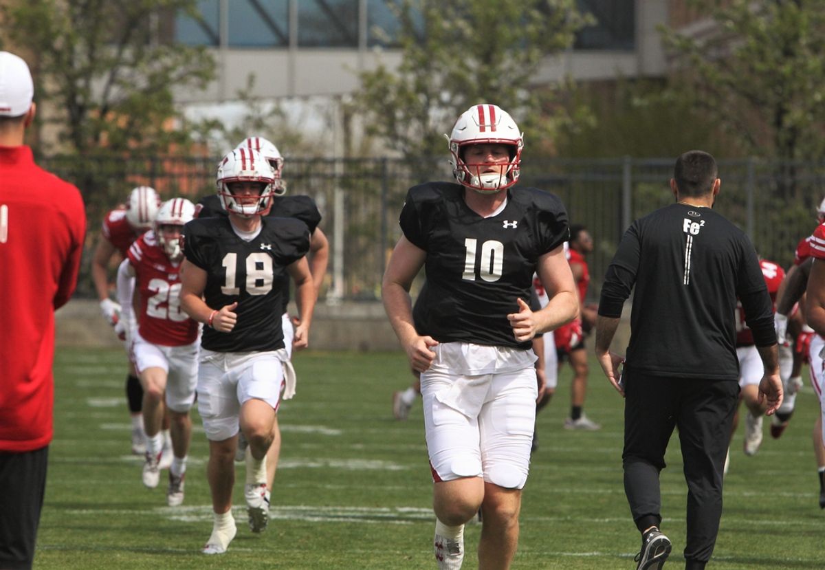 Wisconsin quarterbacks Tyler Van Dyke (10) and Braedyn Locke (18) warm up on the field north of Camp Randall Stadium in Madison, Wisconsin on Saturday April 27, 2024 before the team's intrasquad scrimmage.