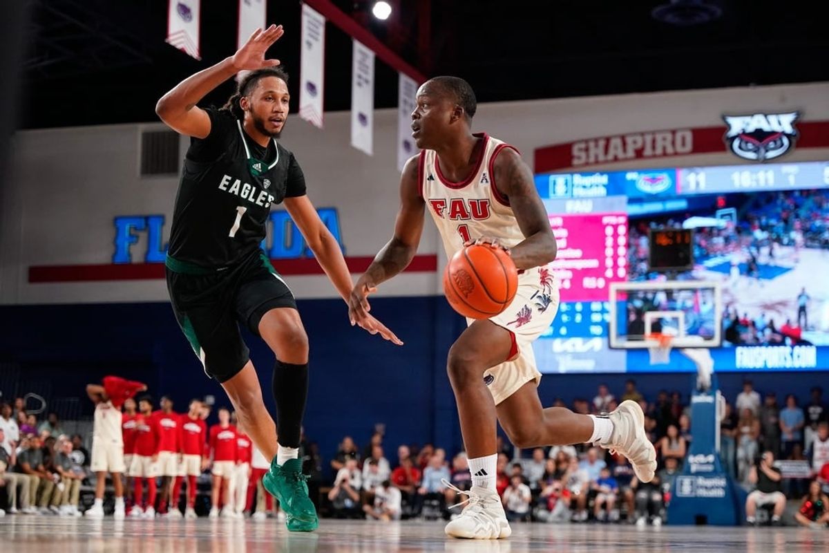 Nov 14, 2023; Boca Raton, Florida, USA; Florida Atlantic Owls guard Johnell Davis (1) dribbles the ball past Eastern Michigan Eagles forward Jalin Billingsley (1) during the first half at Eleanor R. Baldwin Arena.