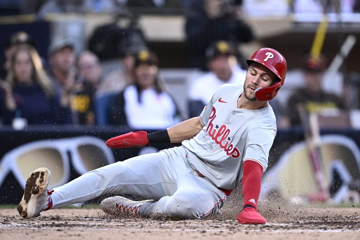Apr 27, 2024; San Diego, California, USA; Philadelphia Phillies shortstop Trea Turner (7) slides home to score a run during the fifth inning against the San Diego Padres at Petco Park. Mandatory Credit: Orlando Ramirez-USA TODAY Sports