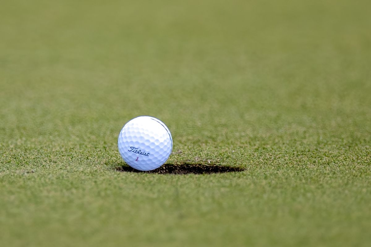 Apr 28, 2024; Avondale, Louisiana, USA; Detailed view of a Titleist Pro V1 Classic golf ball falling into the hole on the practice green being used on the practice green during the final round of the Zurich Classic of New Orleans golf tournament. Mandatory Credit: Stephen Lew-Imagn Images