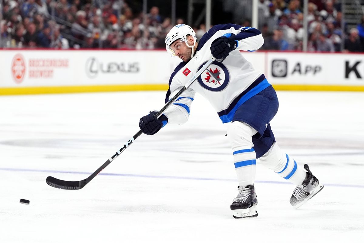 Apr 28, 2024; Denver, Colorado, USA; Winnipeg Jets defenseman Dylan DeMelo (2) shoots the puck during the third period against the Colorado Avalanche in game four of the first round of the 2024 Stanley Cup Playoffs at Ball Arena. Mandatory Credit: Ron Chenoy-Imagn Images