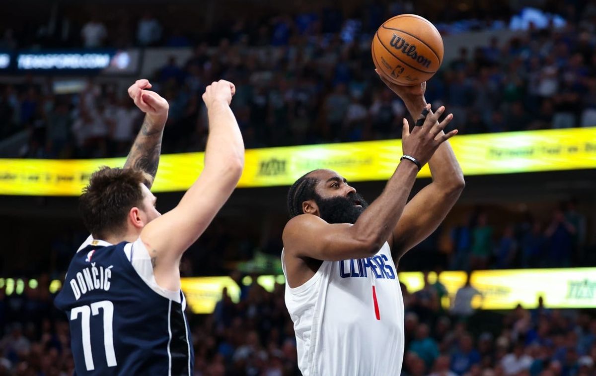 Apr 28, 2024; Dallas, Texas, USA;  LA Clippers guard James Harden (1) shoots past Dallas Mavericks guard Luka Doncic (77) during the second half during game four of the first round for the 2024 NBA playoffs at American Airlines Center. Mandatory Credit: Kevin Jairaj-USA TODAY Sports