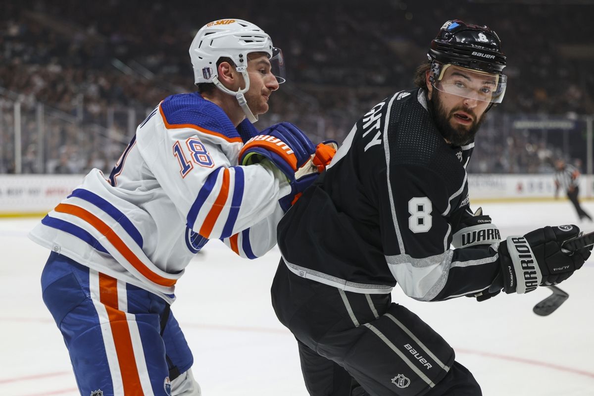 Apr 28, 2024; Los Angeles, California, USA; Edmonton Oilers left wing Zach Hyman (18) checks Los Angeles Kings defensemen Drew Doughty (8) in the first period of game four of the first round of the 2024 Stanley Cup Playoffs at Crypto.com Arena. Mandatory Credit: Yannick Peterhans-Imagn Images