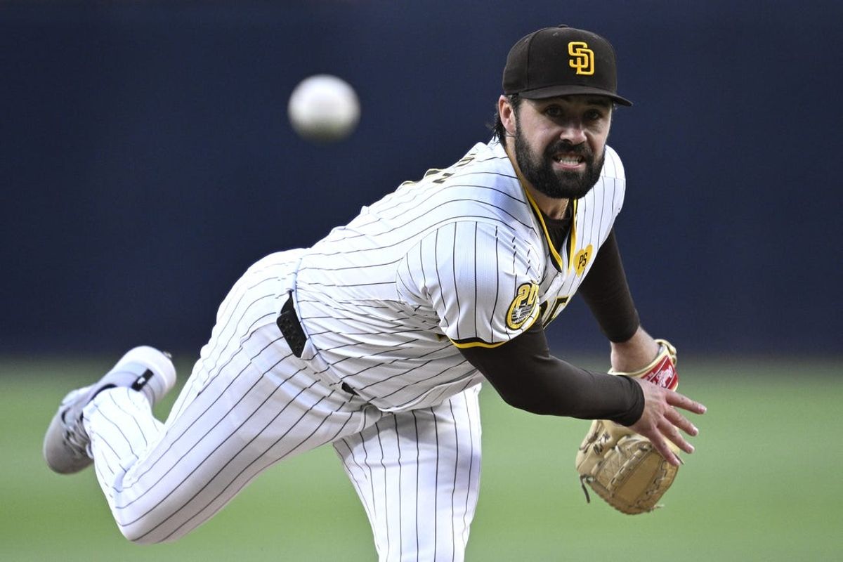 Apr 29, 2024; San Diego, California, USA; San Diego Padres starting pitcher Matt Waldron (61) throws a pitch against the Cincinnati Reds during the first inning at Petco Park. Mandatory Credit: Orlando Ramirez-USA TODAY Sports