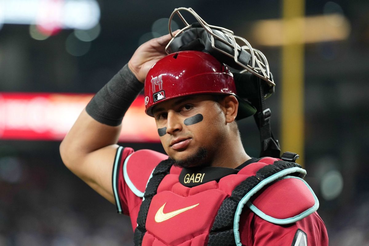 Apr 29, 2024; Phoenix, Arizona, USA; Arizona Diamondbacks catcher Gabriel Moreno (14) looks on against the Los Angeles Dodgers during the fourth inning at Chase Field. Mandatory Credit: Joe Camporeale-USA TODAY Sports