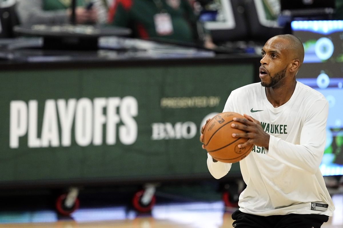 Apr 30, 2024; Milwaukee, Wisconsin, USA;  Milwaukee Bucks forward Khris Middleton (22) shoots during warmups prior to game five of the first round for the 2024 NBA playoffs against the Indiana Pacers at Fiserv Forum. Mandatory Credit: Jeff Hanisch-USA TODAY Sports