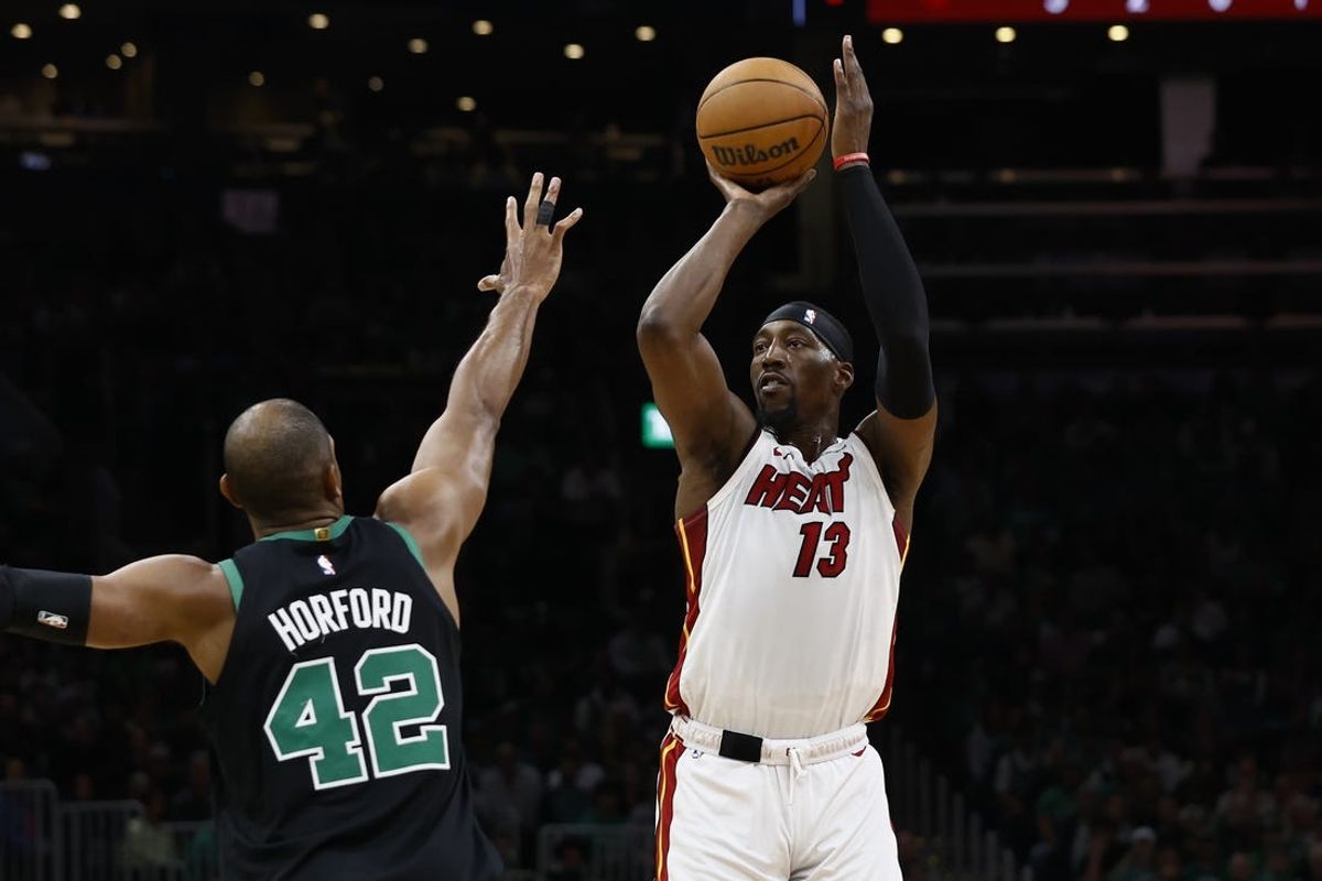 May 1, 2024; Boston, Massachusetts, USA; Miami Heat center Bam Adebayo (13) shoots against Boston Celtics center Al Horford (42) during the first quarter of game five of the first round of the 2024 NBA playoffs at TD Garden. Mandatory Credit: Winslow Townson-USA TODAY Sports