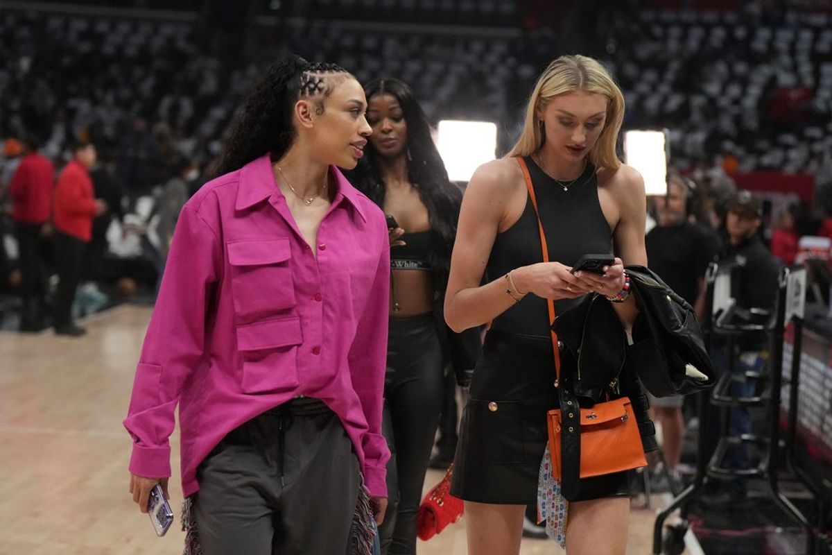 May 1, 2024; Los Angeles, California, USA; LA Sparks players Dearica Hamby (left) and Cameron Brink attend game five of the first round for the 2024 NBA playoffs between the LA Clippers and the Dallas Mavericks at Crypto.com Arena. Mandatory Credit: Kirby Lee-USA TODAY Sports