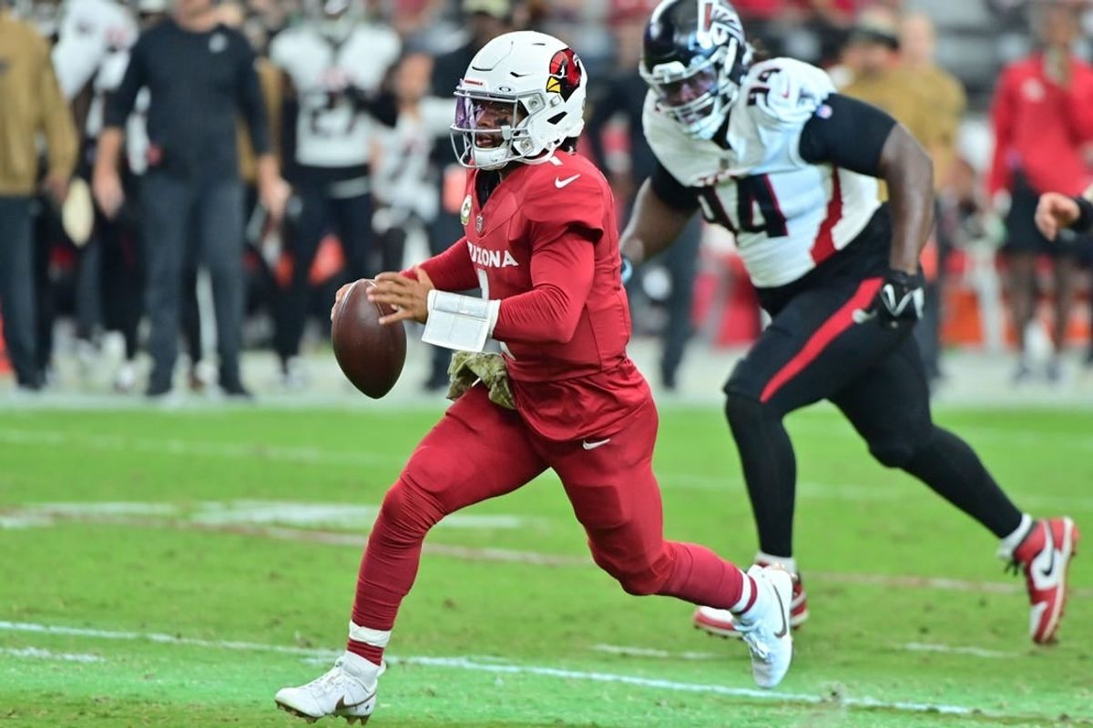 Nov 12, 2023; Glendale, Arizona, USA;  Arizona Cardinals quarterback Kyler Murray (1) runs with the ball as Atlanta Falcons defensive tackle Albert Huggins (94) pursues in the first half at State Farm Stadium.